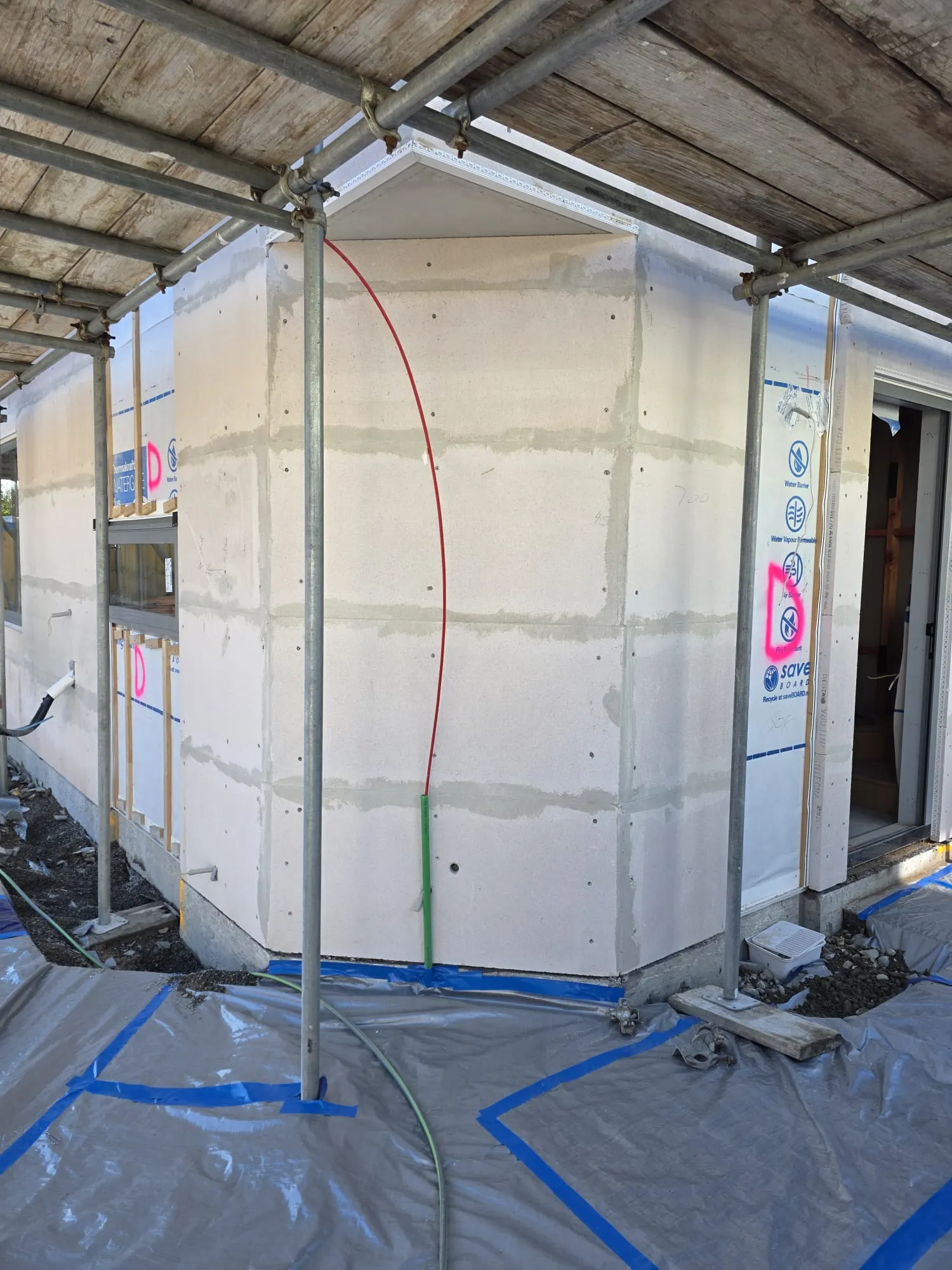 Joints taped and reinforced on backing board before plaster coats