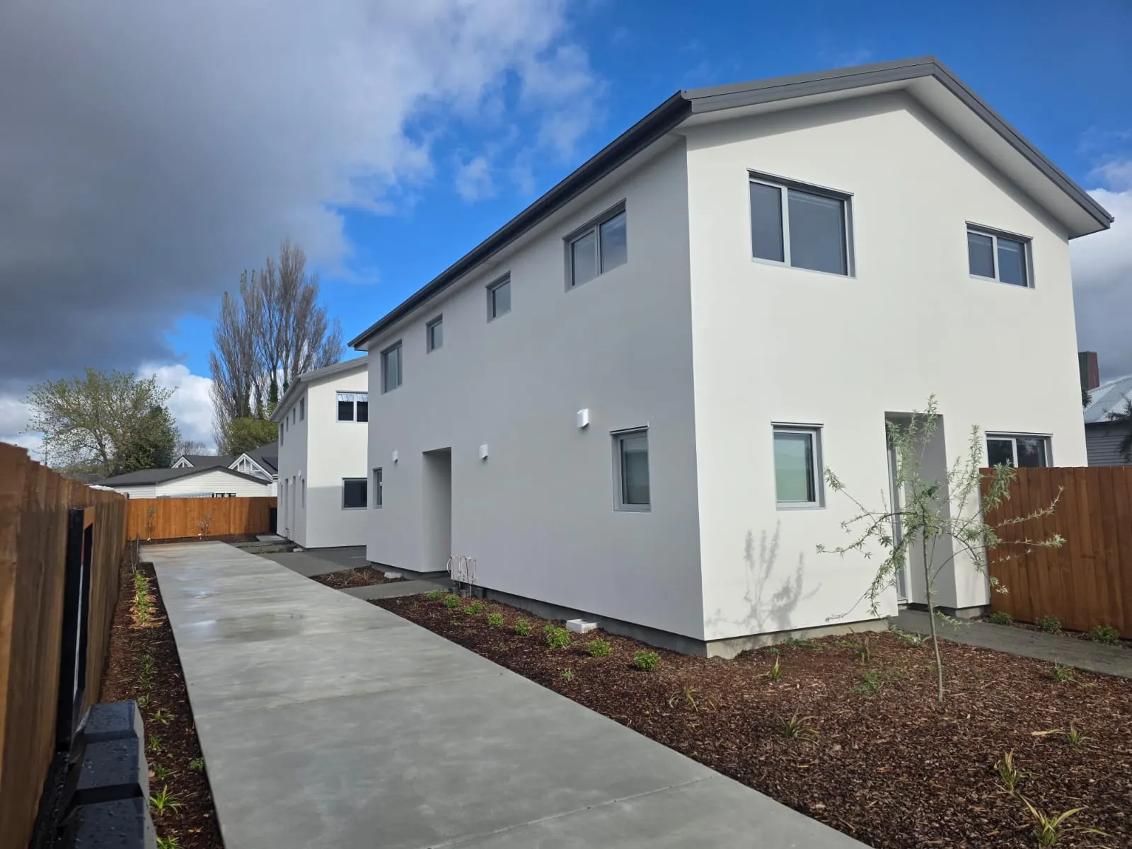 Two-storey house with flawless white exterior plaster finish