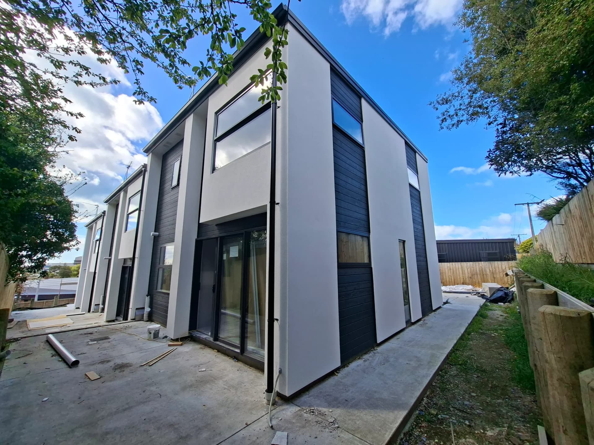 Side elevation of townhouses showing crisp plaster corners and window reveals